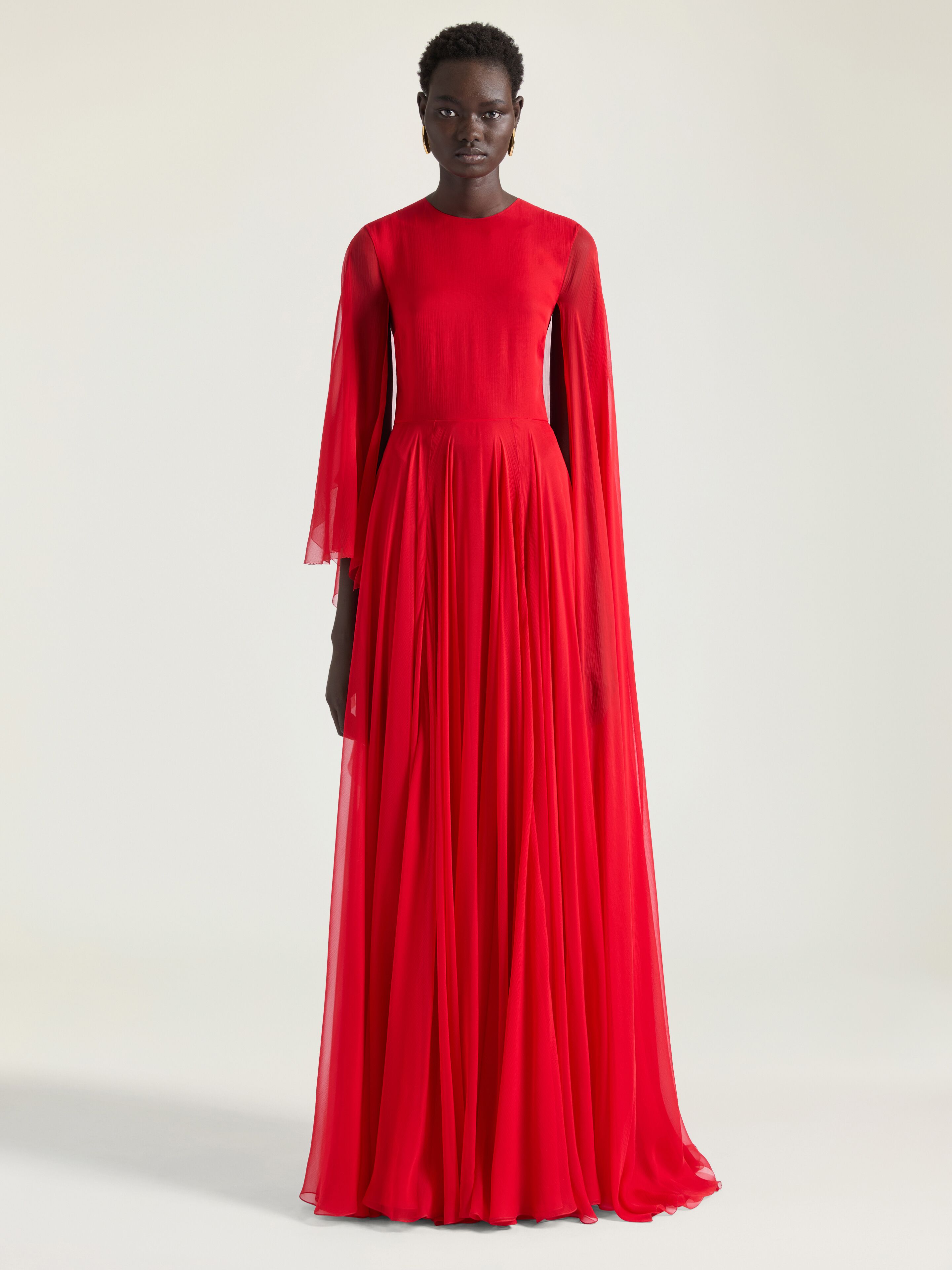Draped evening dress in chiffon with cape